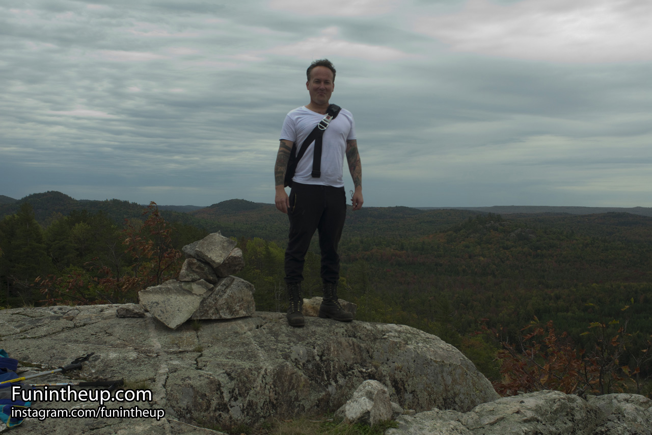 Shawn at the tallest point on Bald Mountain with views into the Huron Mountain Club property.