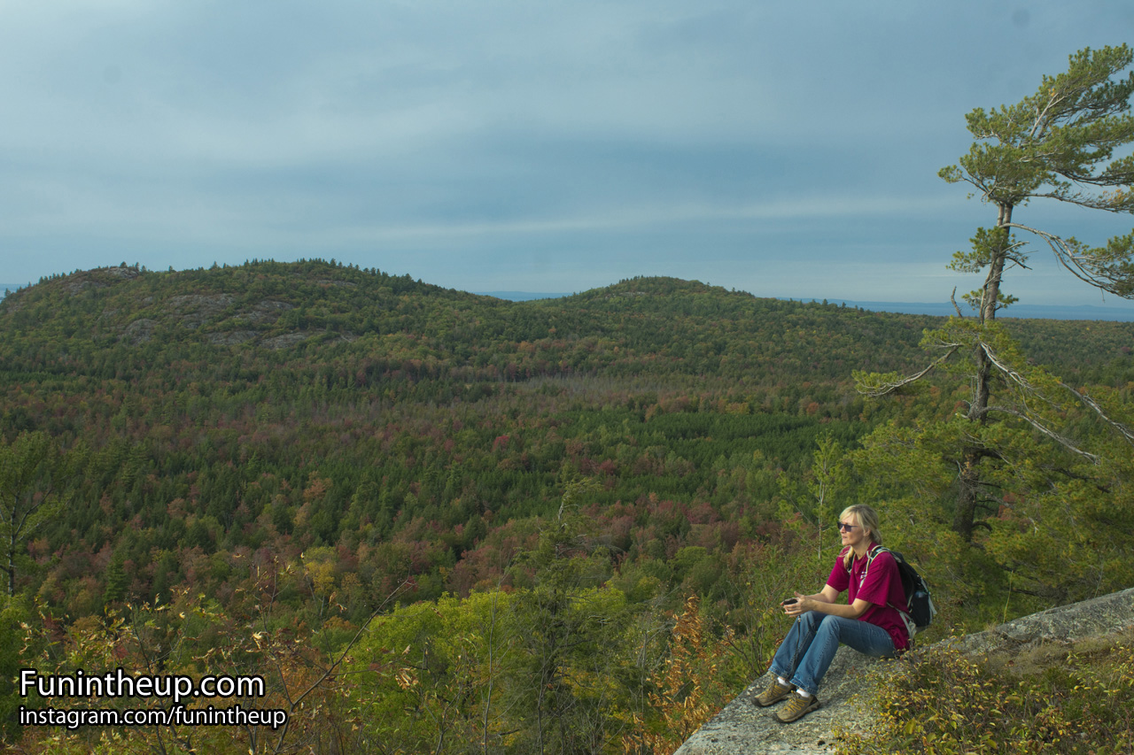 Jennifer taking in the views to the south, west, and north on Ghost Peak.